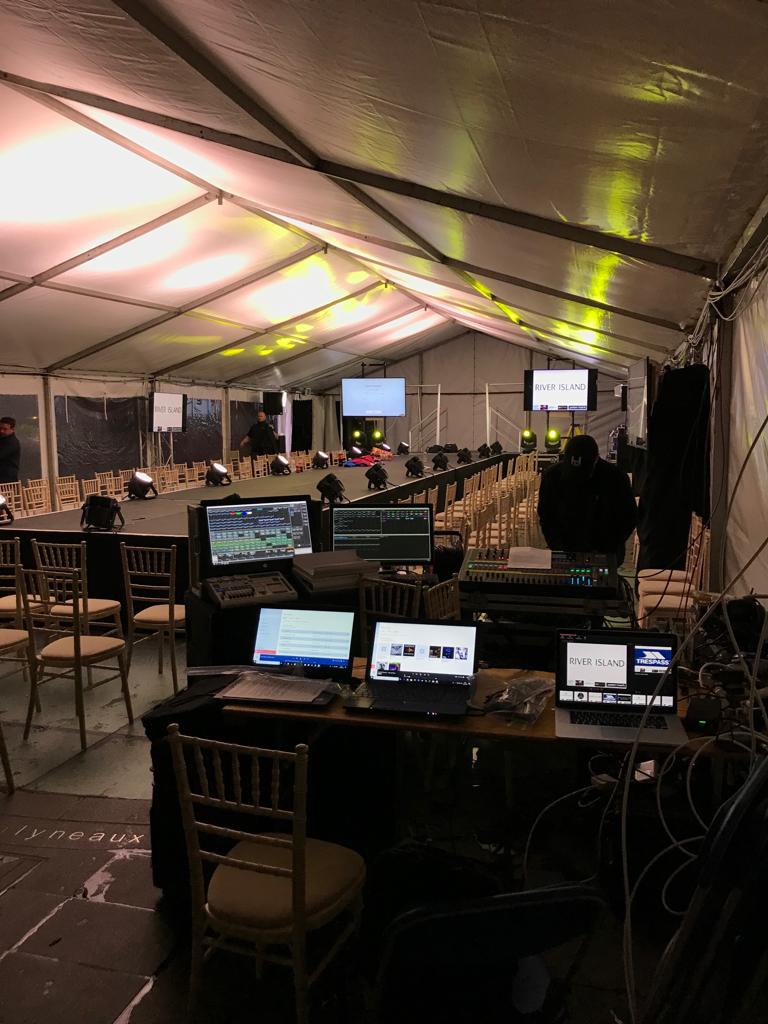 Event production setup with lighting and staging